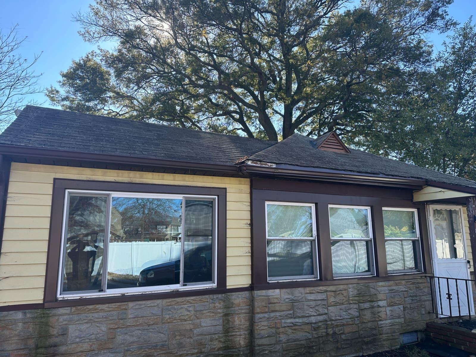 Rebuilt roofline with repaired fascia and re-hung gutters on Central NJ home