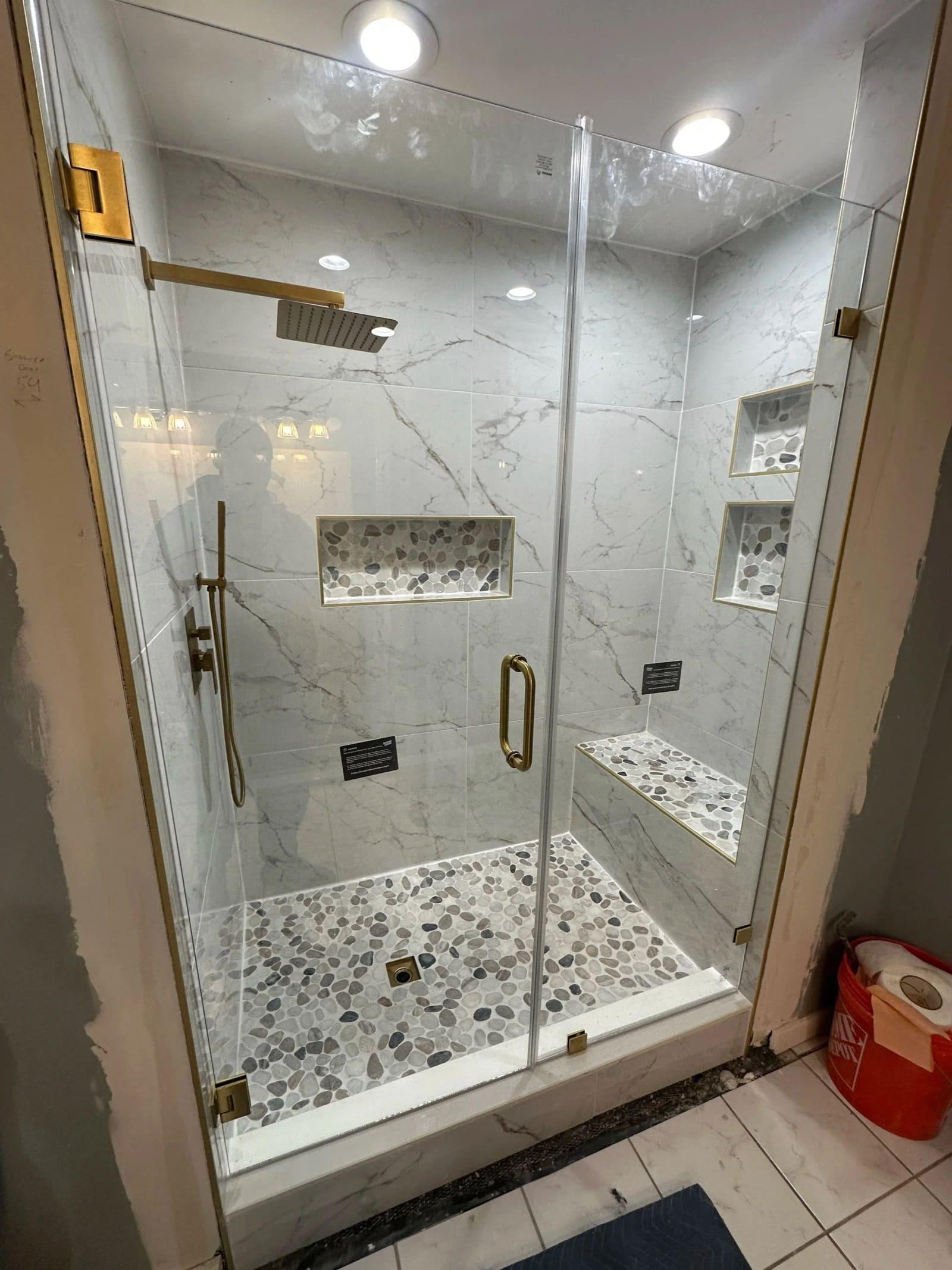 Tile niche and fixture detail in custom shower remodel